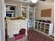 A bedroom with neutral walls, multiple closets, and play furniture at 312 North Blvd W, Davenport, FL 33837