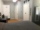 A primary bedroom with neutral walls, with a light wood floor, closet, and decor at 312 North Blvd W, Davenport, FL 33837