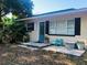 Charming single-story home featuring a cozy front porch and well-maintained landscaping at 312 North Blvd W, Davenport, FL 33837