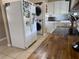 A functional kitchen with light cabinets, butcher block countertops, stacked washer and dryer at 312 North Blvd W, Davenport, FL 33837