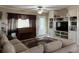 Spacious living room boasts built-in shelving, a piano, and a comfortable seating area at 312 North Blvd W, Davenport, FL 33837