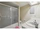 Bright bathroom with shower and vanity, offering comfort and convenience for occupants at 35138 Silver Oak Dr, Leesburg, FL 34788