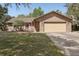 Charming brick home with a well-manicured lawn and attached two-car garage at 35138 Silver Oak Dr, Leesburg, FL 34788