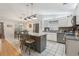 Spacious kitchen island with stainless appliances and white cabinets at 35138 Silver Oak Dr, Leesburg, FL 34788