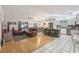 Open-concept floor plan with a cozy living room and an eat-in kitchen island at 35138 Silver Oak Dr, Leesburg, FL 34788