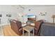 Bright living room with hardwood floors, vaulted ceiling, and modern furniture at 35138 Silver Oak Dr, Leesburg, FL 34788
