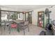 Covered patio with dining area, ceiling fan, tile floor, and view of backyard at 35138 Silver Oak Dr, Leesburg, FL 34788