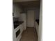 Functional kitchen with white appliances, tile flooring, and ample cabinet space for storage at 3748 Idlebrook Cir # 202, Casselberry, FL 32707