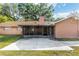 Backyard with screened in porch, patio and view of the lawn at 400 Sw 35Th St, Ocala, FL 34471
