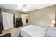 Bedroom featuring neutral colors, natural light, ceiling fan, and access to a walk-in closet at 400 Sw 35Th St, Ocala, FL 34471