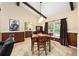 Dining room with wooden table, exposed beams, and lots of natural light at 400 Sw 35Th St, Ocala, FL 34471