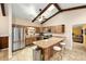 Bright eat-in kitchen with stainless steel appliances, wood cabinets, a breakfast bar, and lots of counter space at 400 Sw 35Th St, Ocala, FL 34471