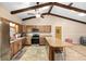 Well-lit kitchen featuring wood cabinets, stainless steel appliances, a breakfast bar, and ample counter space, ideal for cooking at 400 Sw 35Th St, Ocala, FL 34471