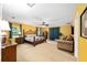 Bright and spacious bedroom with colorful walls, a ceiling fan, and ample natural light provides a cheerful and relaxing space at 400 Sw 35Th St, Ocala, FL 34471