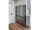 Kitchen showing stainless steel refrigerator and white cabinets with quartz countertops at 412 Sunny Ct, Fruitland Park, FL 34731