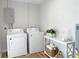 Bright laundry room featuring washer and dryer at 412 Sunny Ct, Fruitland Park, FL 34731