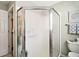 Bathroom view of a glass enclosed shower with a framed artwork and towel rack visible at 419 Aldama Ave, The Villages, FL 32159