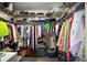 Walk-in closet with ample storage, including shelves, hanging rods, and floor space at 419 Aldama Ave, The Villages, FL 32159