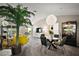 Open dining area with a modern chandelier, dining table, and comfortable chairs at 419 Aldama Ave, The Villages, FL 32159