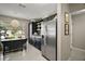 Stylish kitchen featuring dark cabinets, stainless steel appliances, and ample counter space at 419 Aldama Ave, The Villages, FL 32159