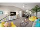 Bright living room featuring plush seating, modern decor, and an open floor plan at 419 Aldama Ave, The Villages, FL 32159