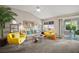 Inviting living room with comfortable seating, a sliding glass door, and lots of natural light at 419 Aldama Ave, The Villages, FL 32159