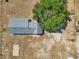 Overhead shot showcasing a well-maintained roof, a large tree, and the layout of the property at 4635 Brantley Rd, Groveland, FL 34736