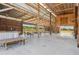 Barn interior with tables, chairs, and rustic wagon wheel decor at 4635 Brantley Rd, Groveland, FL 34736
