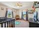 Charming bedroom filled with natural light, cute decor, and a cozy atmosphere at 4635 Brantley Rd, Groveland, FL 34736