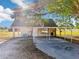 Property featuring an outdoor carport area with shaded parking and an adjacent enclosed structure at 4635 Brantley Rd, Groveland, FL 34736