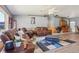 Charming living area boasts hardwood floors, leather furnishings, and a cozy atmosphere at 4635 Brantley Rd, Groveland, FL 34736