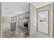 Kitchen featuring grey cabinets, island, and stainless steel appliances at 48 Oakridge Dr, Frostproof, FL 33843