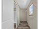 Walk-in closet featuring built-in shelving and a window for natural light at 48 Oakridge Dr, Frostproof, FL 33843