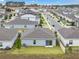 An aerial perspective shows the house nestled within a quiet residential neighborhood at 4905 Vellacito Way, Davenport, FL 33897