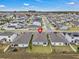 A beautiful neighborhood features homes with well-maintained lawns and serene landscapes at 4905 Vellacito Way, Davenport, FL 33897