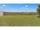 Well-maintained backyard with lush green grass extending to the fenced perimeter at 4905 Vellacito Way, Davenport, FL 33897