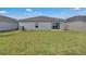 Grassy backyard with a privacy fence, perfect for relaxation and outdoor enjoyment at 4905 Vellacito Way, Davenport, FL 33897