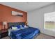 Stylish bedroom with a soothing color scheme and comfortable bedding at 4905 Vellacito Way, Davenport, FL 33897