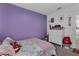 Colorful bedroom with ample storage and playful decor elements at 4905 Vellacito Way, Davenport, FL 33897