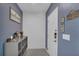 Inviting entryway with modern decor and stylish storage solutions at 4905 Vellacito Way, Davenport, FL 33897