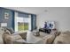 Comfortable living room featuring a large TV and cozy sectional sofa at 4905 Vellacito Way, Davenport, FL 33897