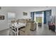Open-plan living room with tile floors, modern decor, and plenty of natural light at 4905 Vellacito Way, Davenport, FL 33897