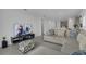 Inviting living room with a cozy sectional sofa and entertainment setup at 4905 Vellacito Way, Davenport, FL 33897