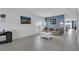 Bright living room featuring neutral walls, tile flooring, and an open floor plan at 4905 Vellacito Way, Davenport, FL 33897