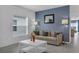 Well lit living room with tile floors and comfortable seating at 4905 Vellacito Way, Davenport, FL 33897