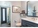 Well-lit bathroom featuring updated vanity, sink and toilet at 5045 Maui Cir # 12, Orlando, FL 32808