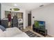 Bedroom featuring hardwood floors, closet and television at 5045 Maui Cir # 12, Orlando, FL 32808