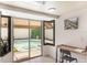 Bright office space features large windows and a view of the outdoor pool area at 5045 Maui Cir # 12, Orlando, FL 32808