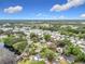 Beautiful aerial view of the community's lush greenery and scenic lakeside setting with picturesque homes at 515 Scenic St, Leesburg, FL 34748