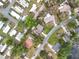 Aerial view of a residential area featuring tree-lined streets and well-maintained homes in a vibrant neighborhood at 515 Scenic St, Leesburg, FL 34748